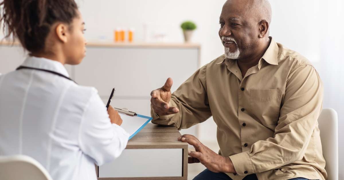 black patient talking to doctor