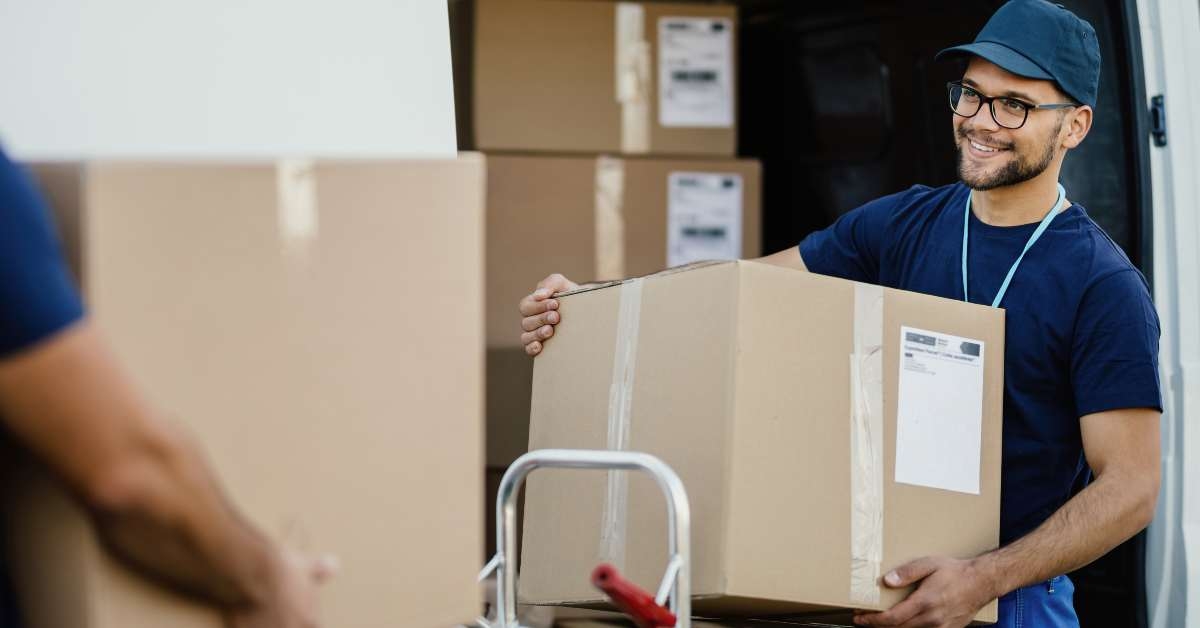 worker unloading cardboard boxes
