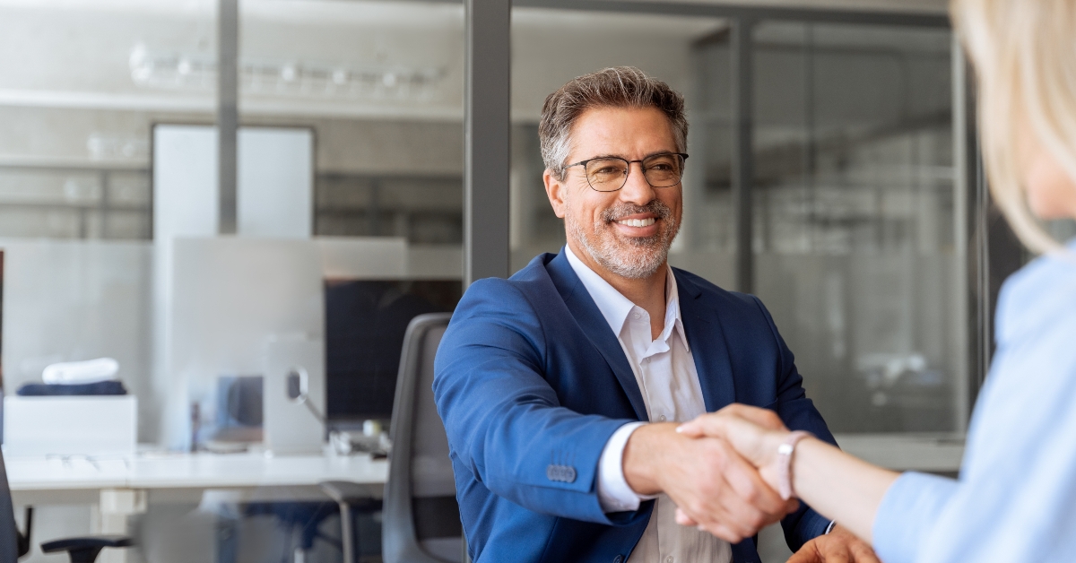 businessman shaking hand with client