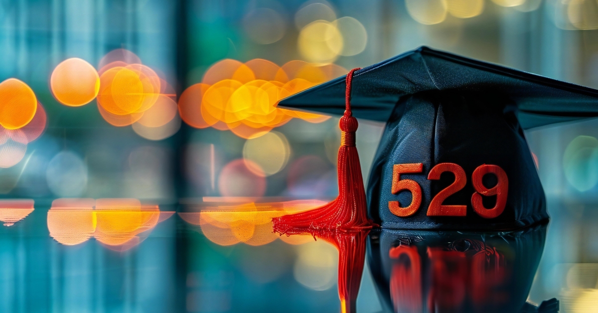 graduation hat placed on top of a reflective desk
