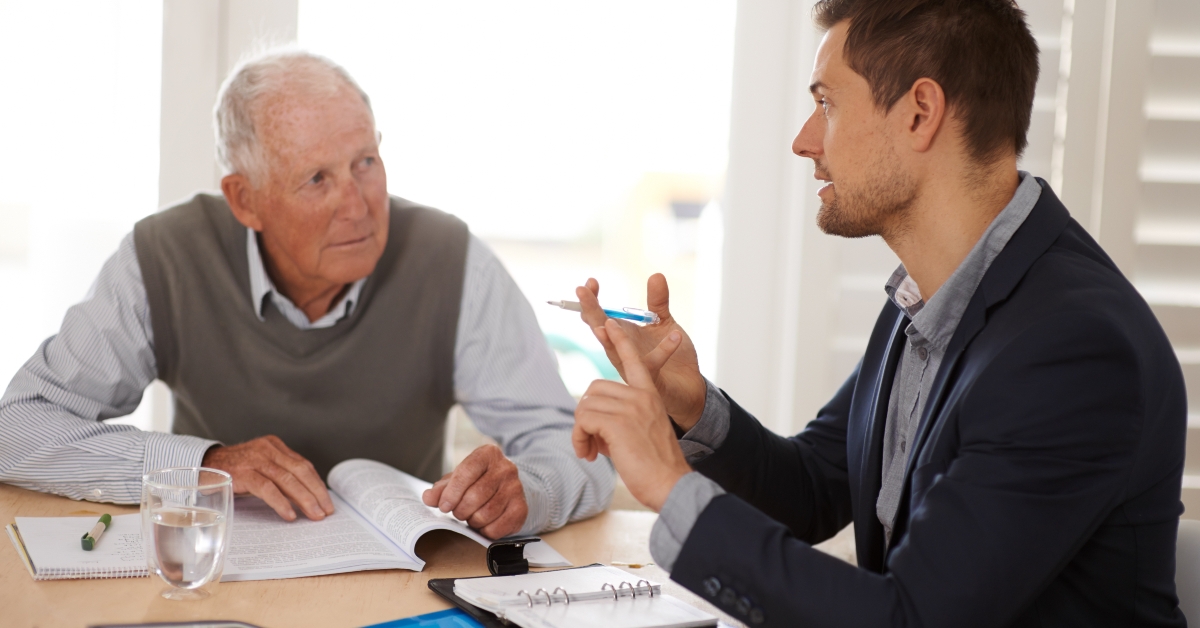 financial advisor talking to a senior man
