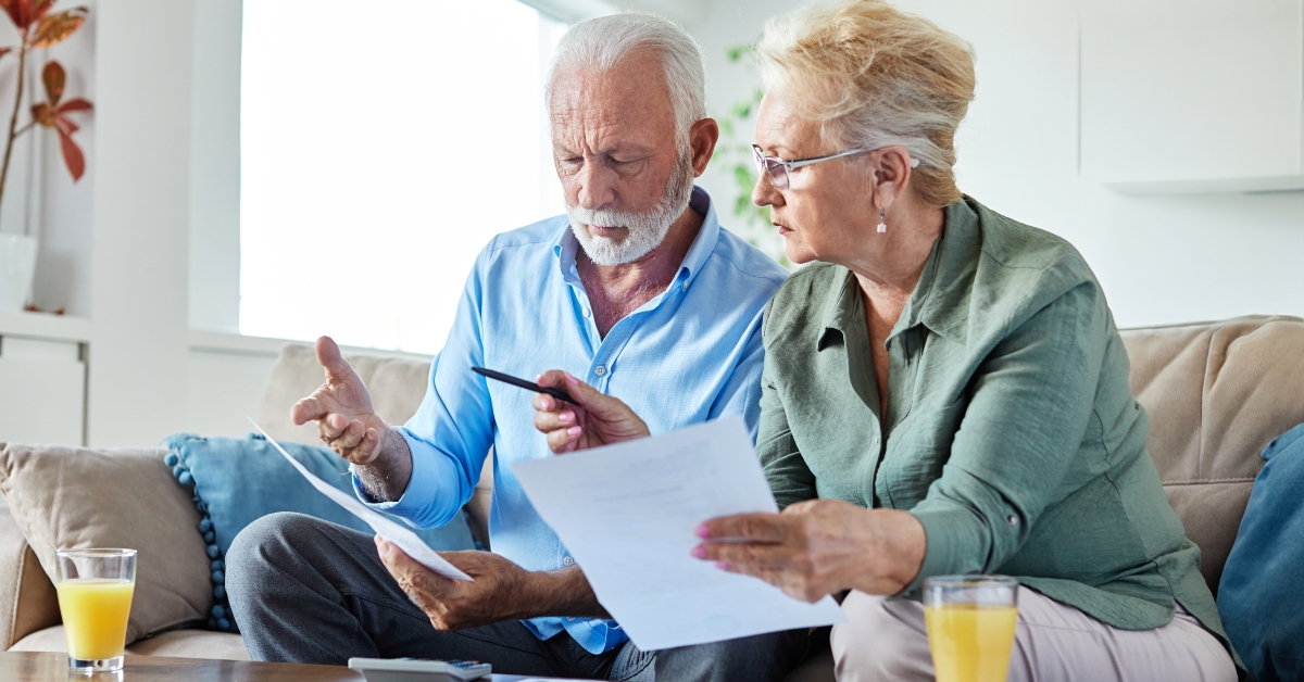 senior couple calculating their bills