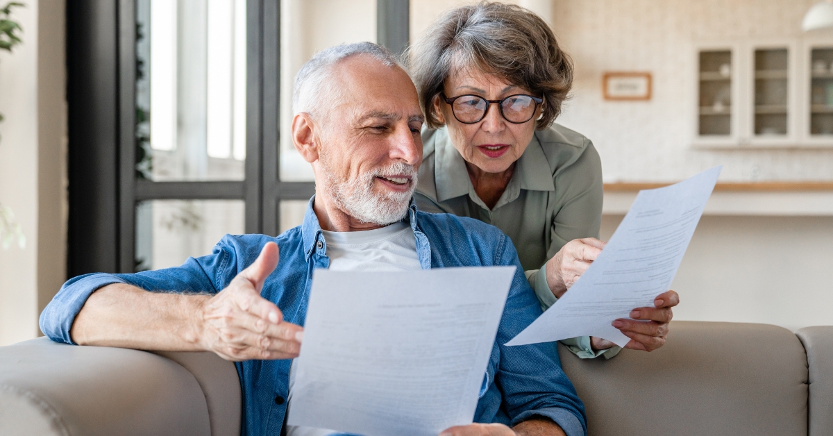 senior couple reading documents