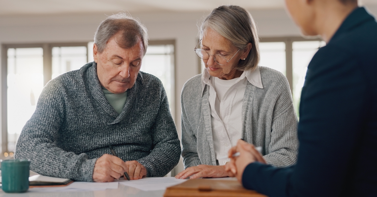 senior couple with financial advisor