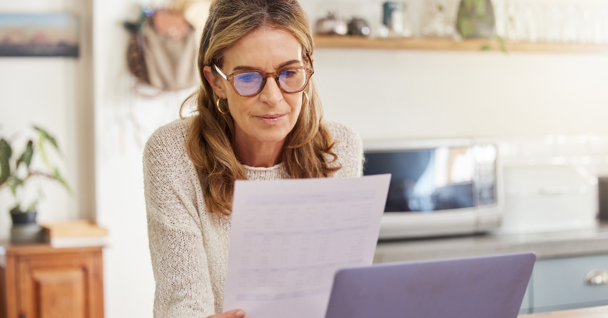 woman reading financial document