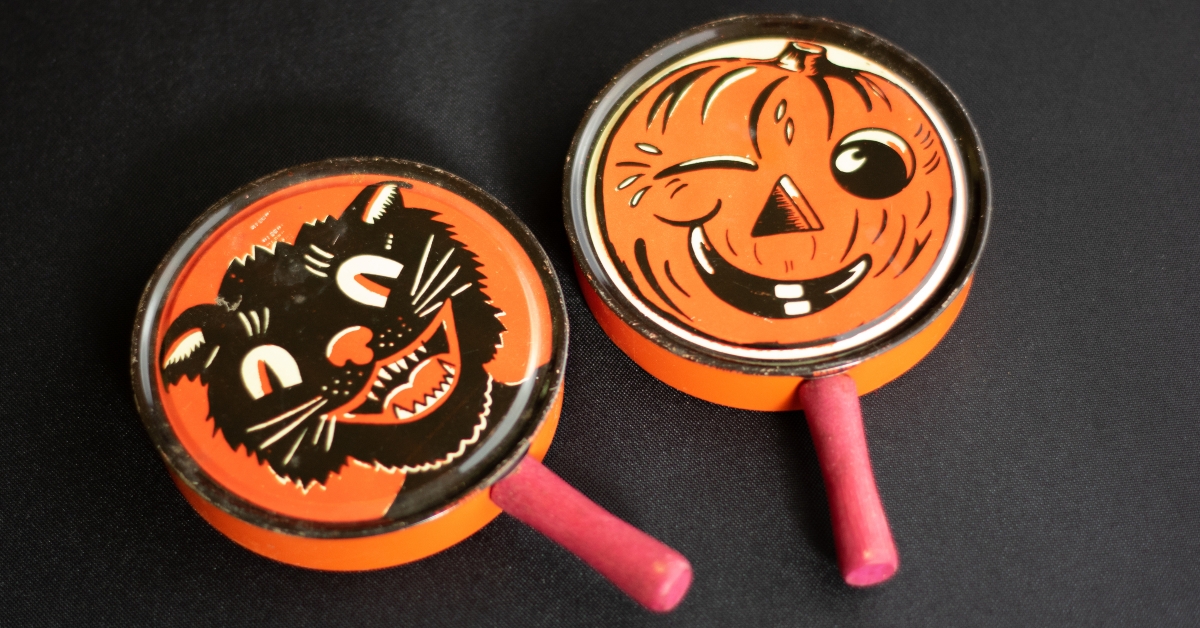 Two Orange and Black Antique Vintage Halloween Noisemaker Toys