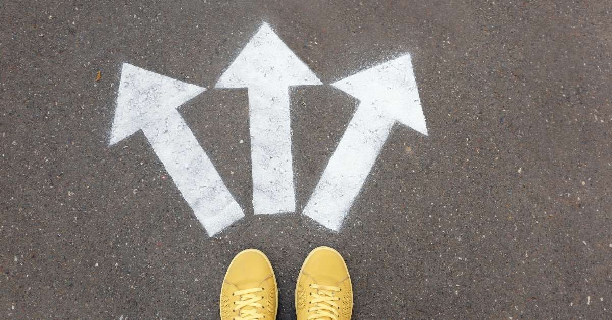 woman standing near arrows