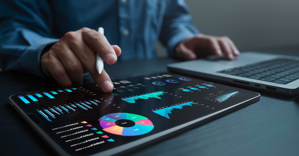 analyst uses a laptop and dashboard for data