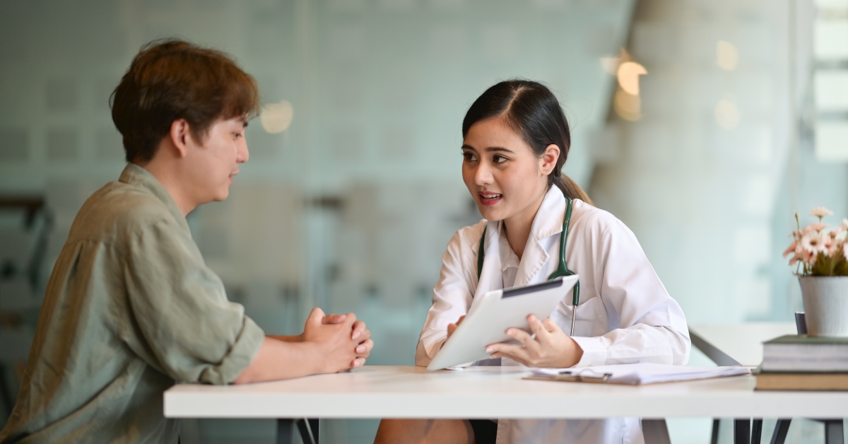 Shot of a doctor showing a patient some information