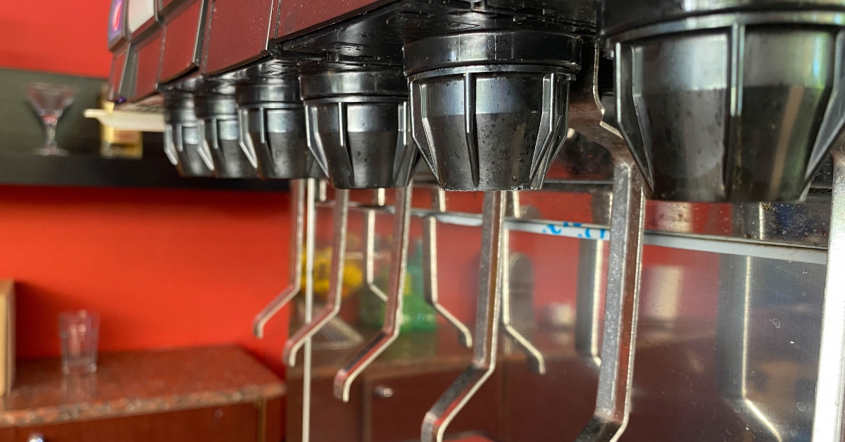 a line of soda dispensers