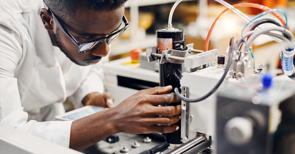African engineer programming equipment with tablet