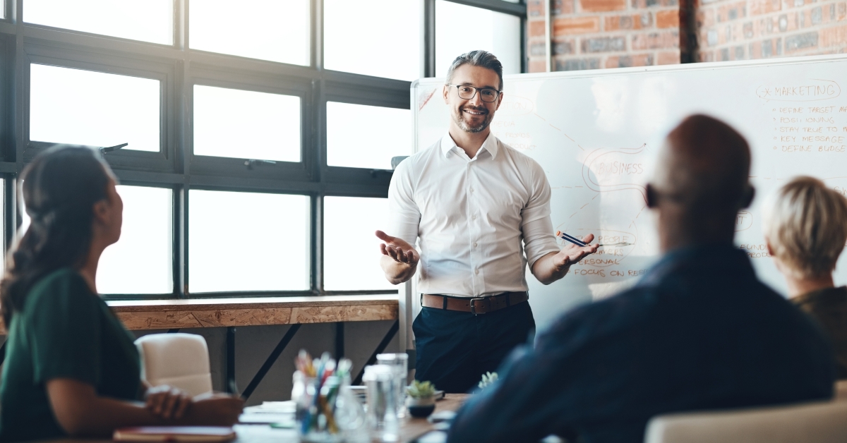 ceo and whiteboard with presentation for business people