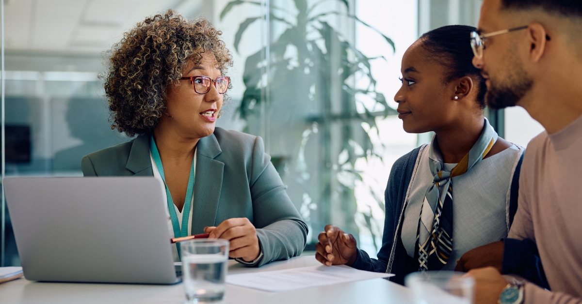 Financial advisor talking to young couple