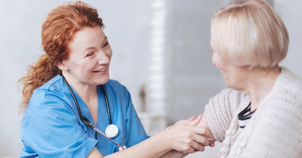 nurse taking care of elderly woman