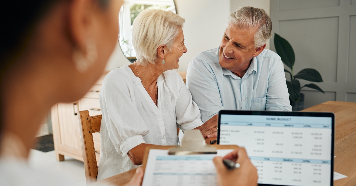 excited man and woman consulting funeral policy worker