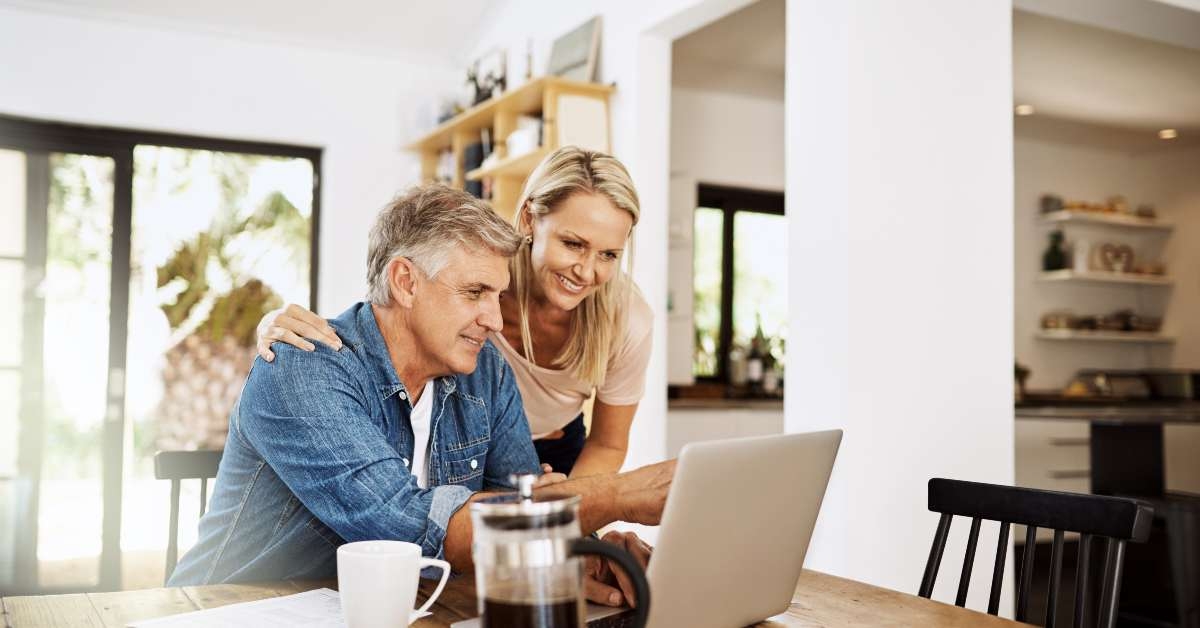 couple with laptop planning finance