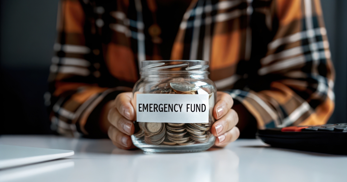 Saving money in a jar labeled emergency fund