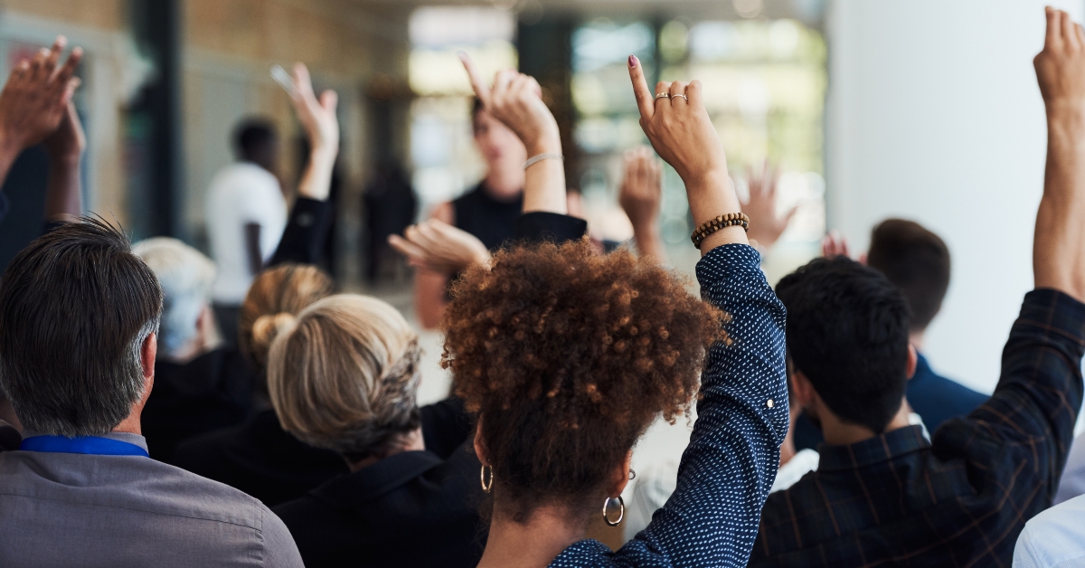 people raising their hands
