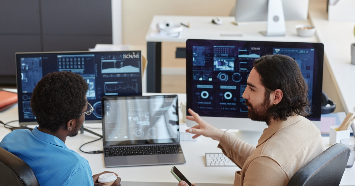 it engineer explaining graphic data to his colleague