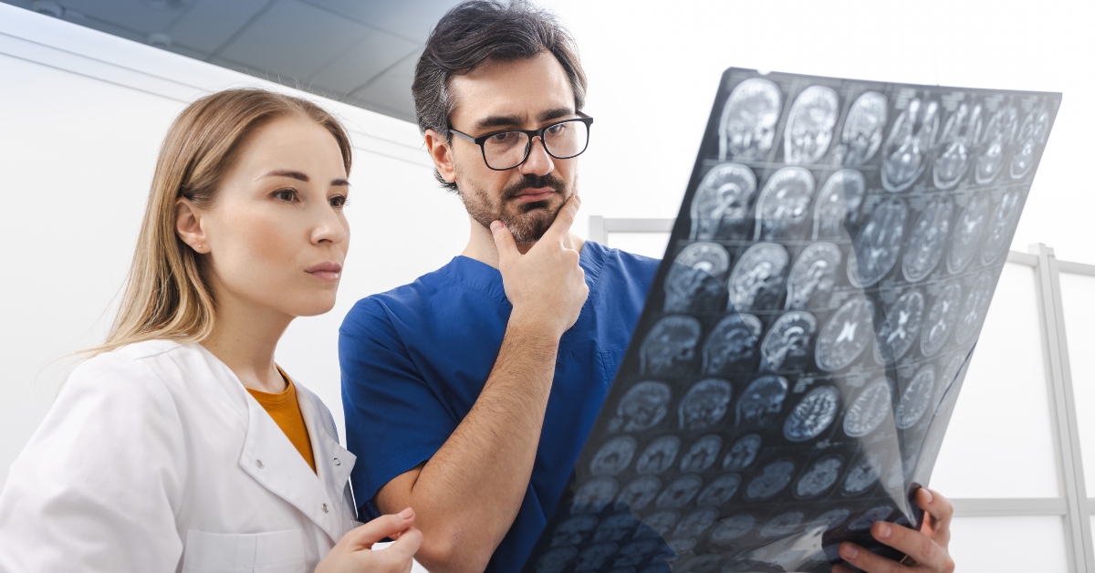doctor with MRI of patient head 