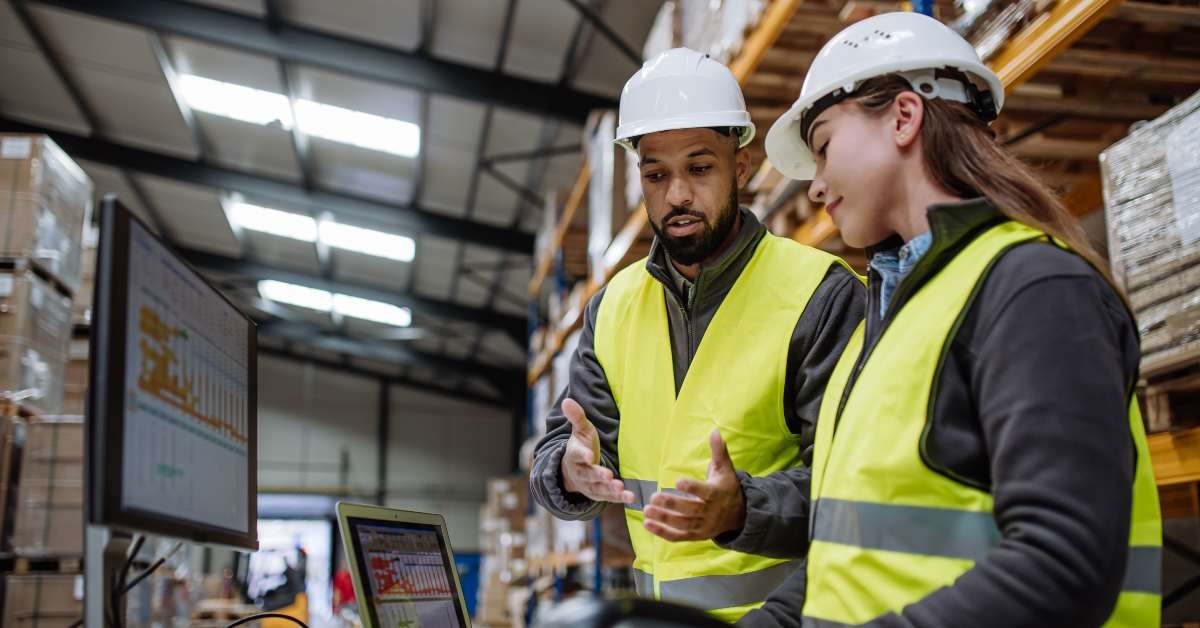 manager talking with logistics employee