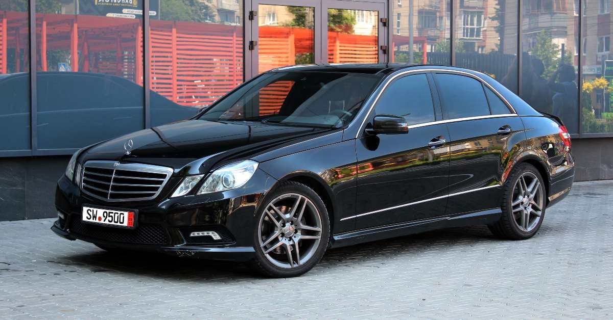 black mercedes benz e350 amg w212 at the city street