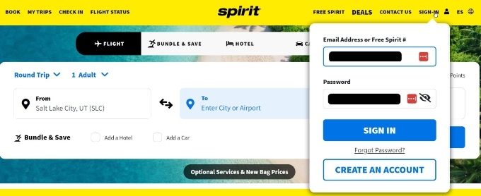 The Spirit Airlines website with the sign-in pop-up open and filled out.