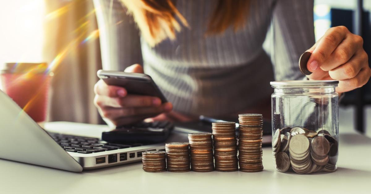 Woman with stack of coins
