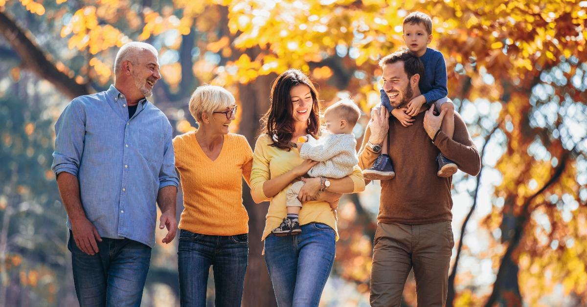 Family laughing in park