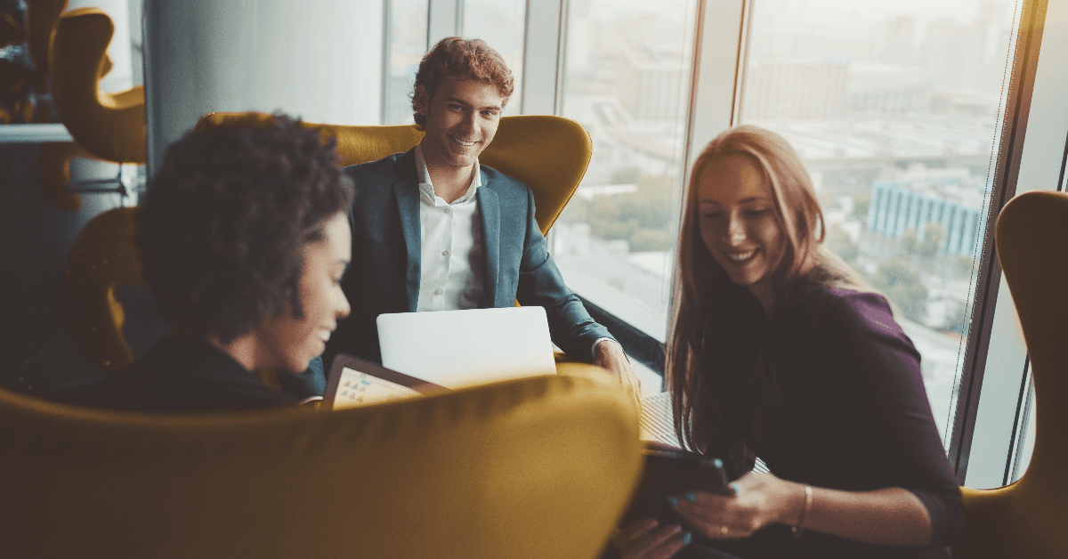 Group of three business people having work meeting 