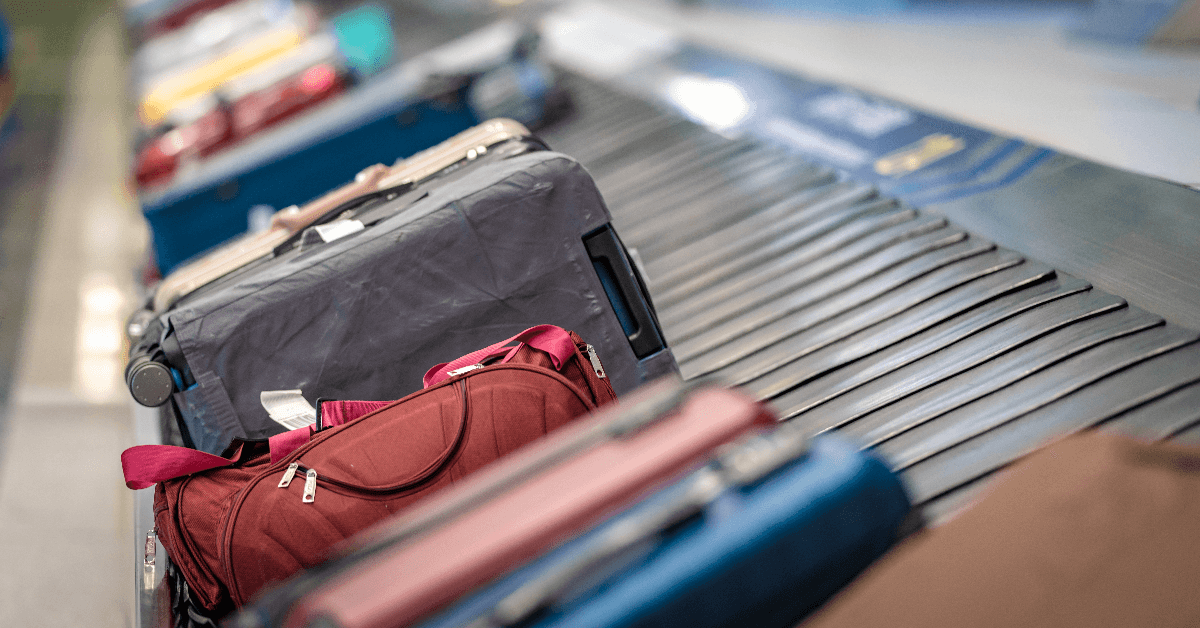 Suitcase Traveling Bags On Conveyor Belt In Airport 