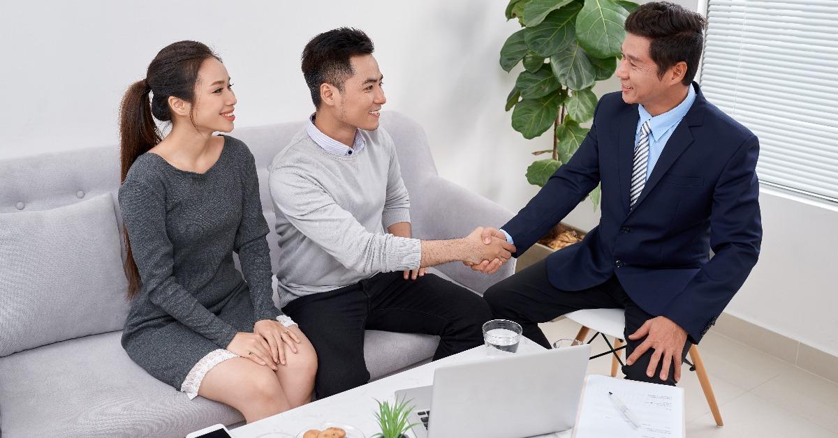 lawyer giving consultation to family couple about wedding plans