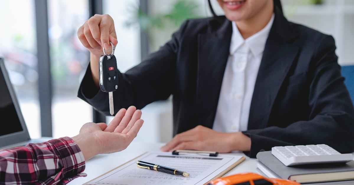 insurance officers hand over the car keys after the tenant 