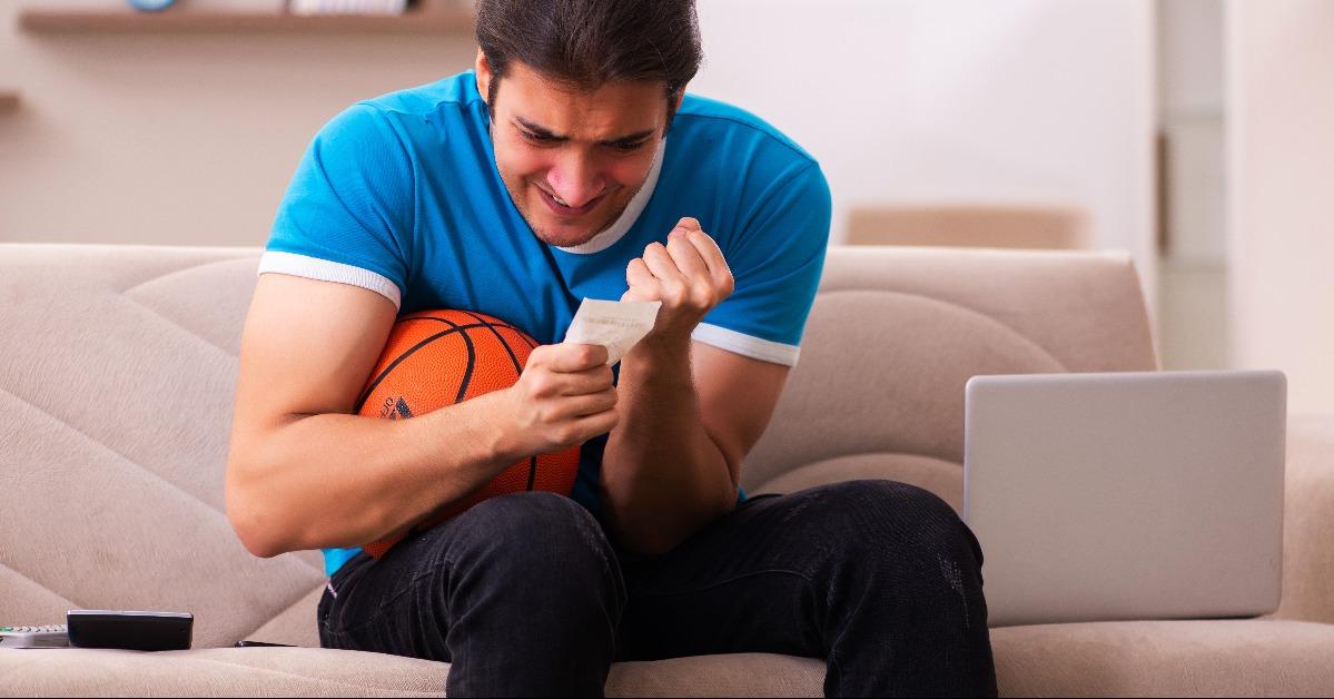 Sport bet addicted young man betting at home