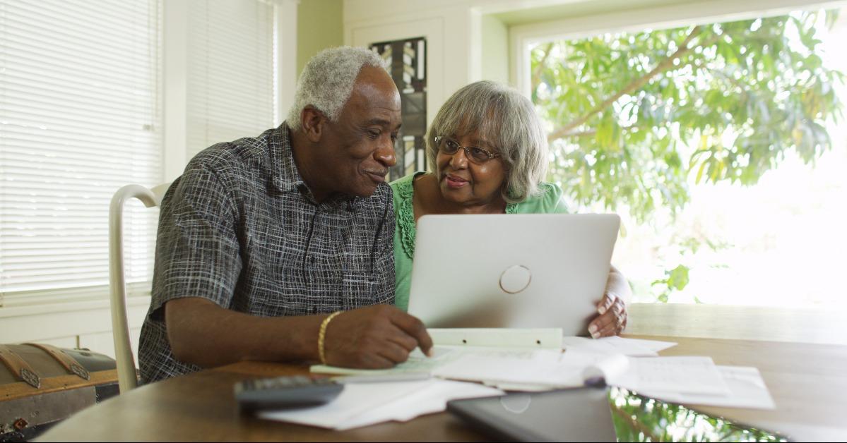 Senior black couple on the laptop computer