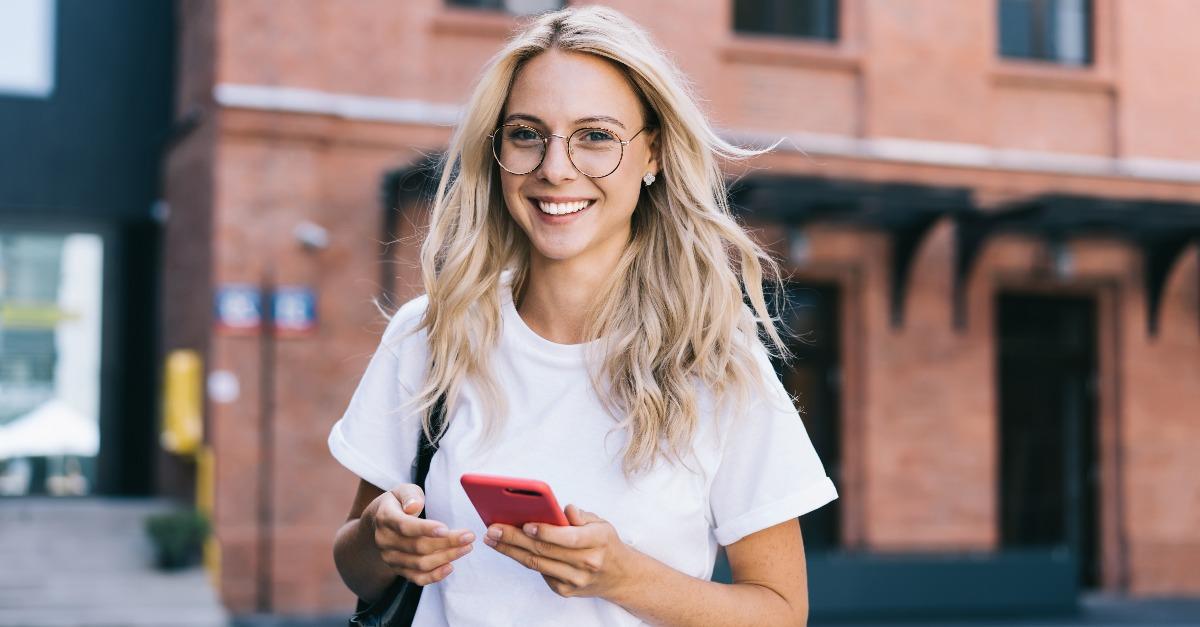 half length portrait of cheerful caucasian female in trendy wear