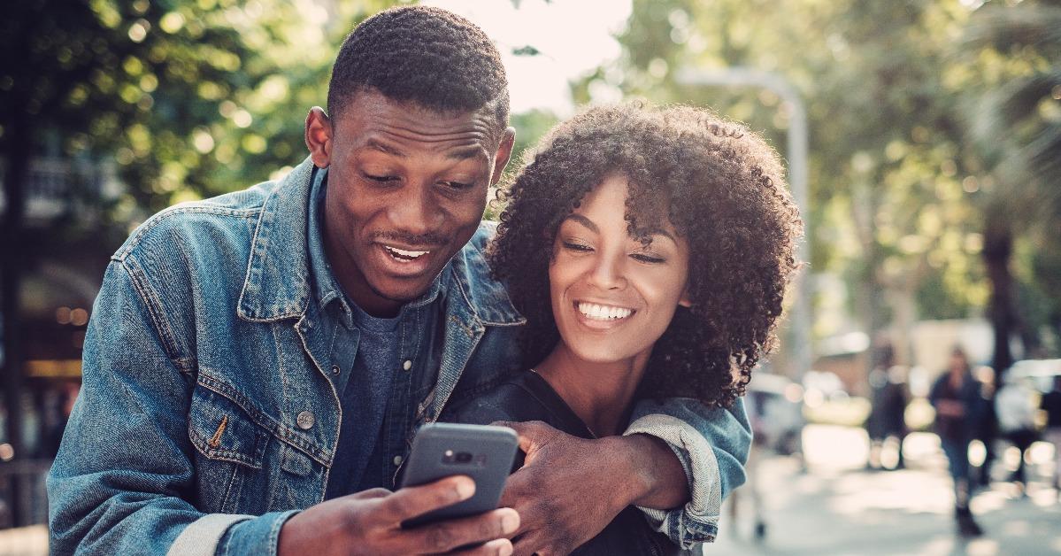 young happy black couple outdoors