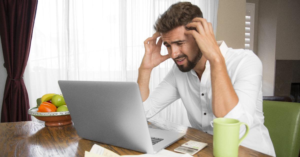 angry man doing his taxes