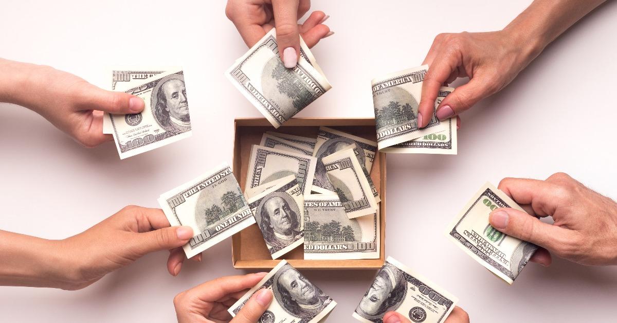 people together collecting money in box