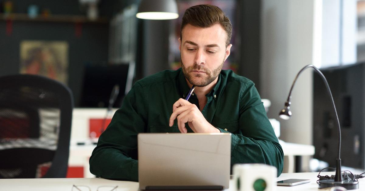 young man studying with laptop computer 