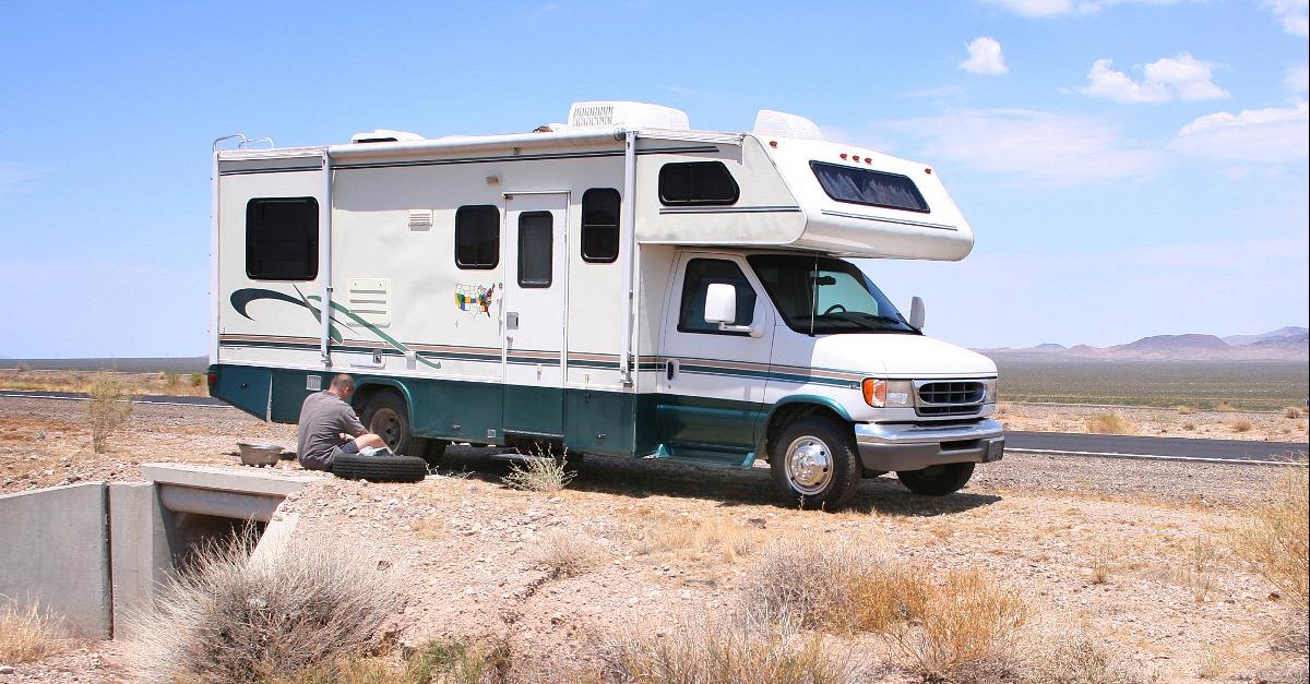motorhome rv with flat tire in desert