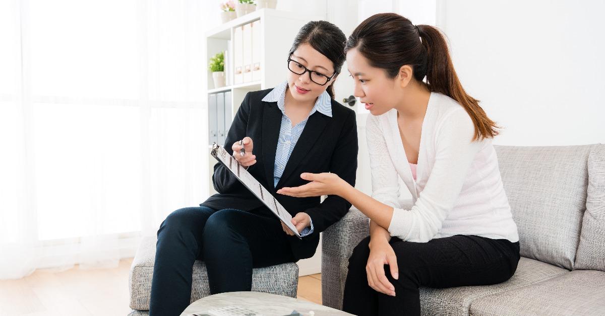 house sales manager showing deal contract document