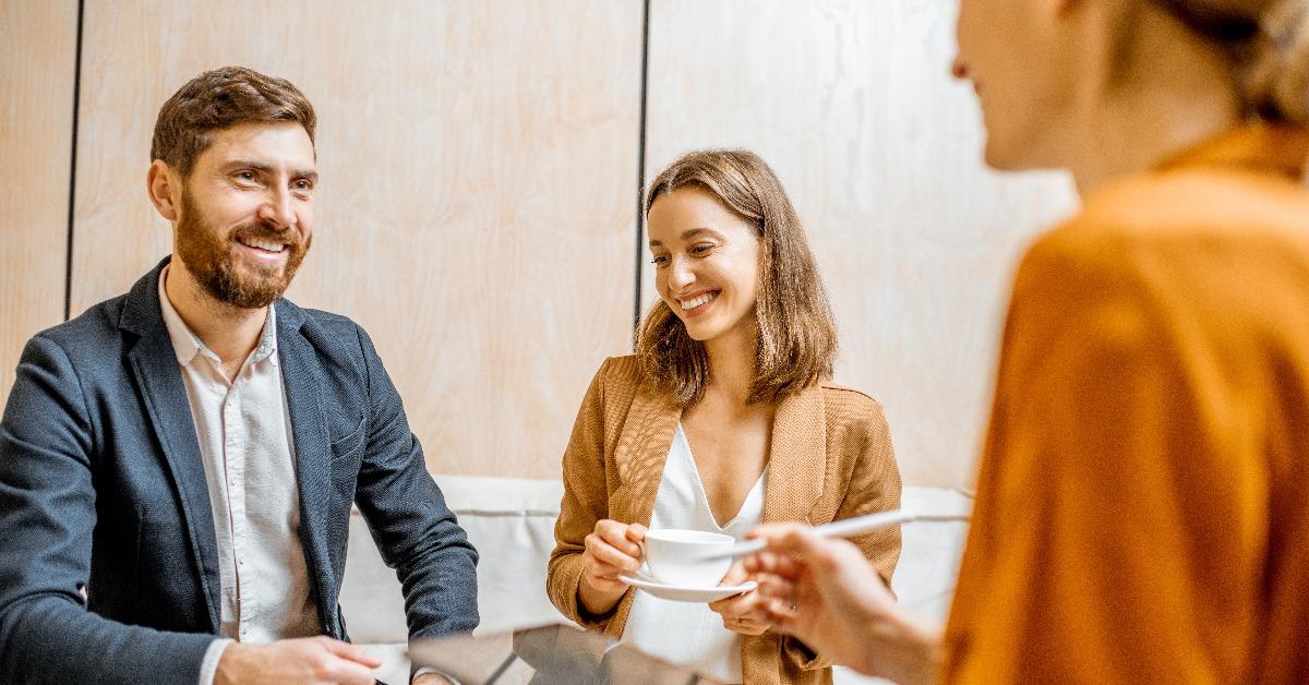 young couple talking with a sales manager