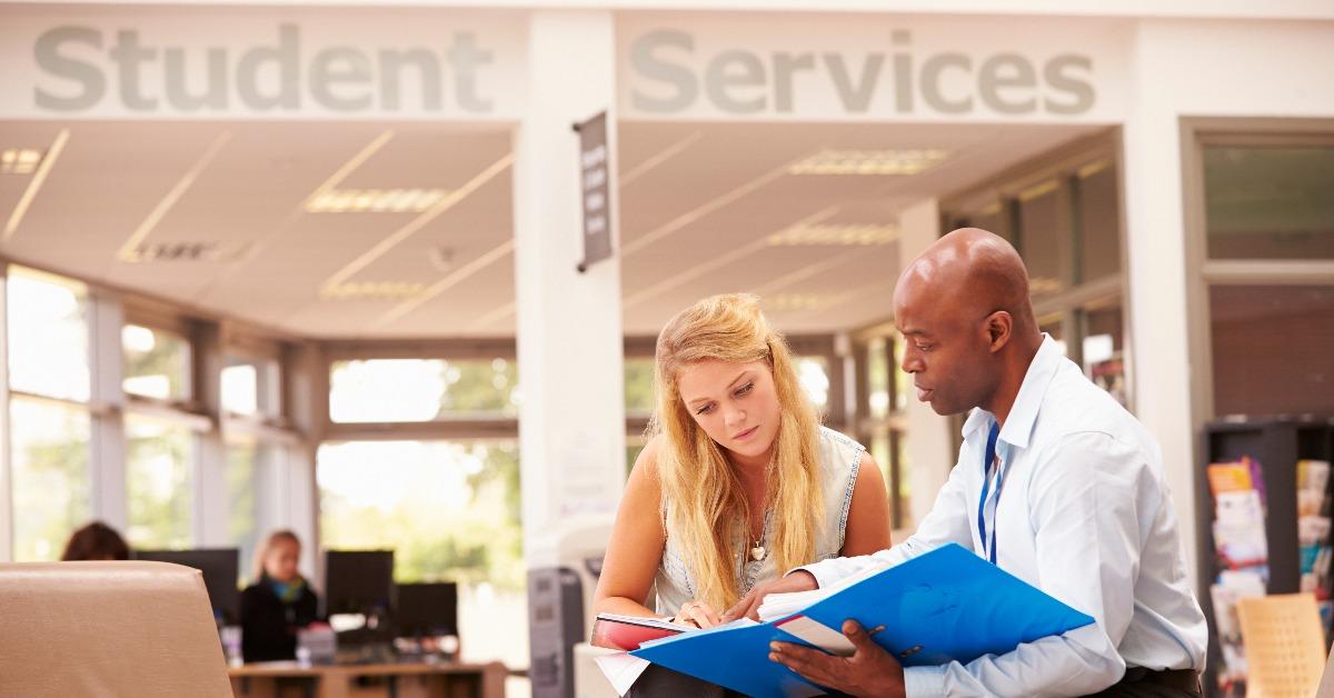 college student having meeting with tutor to discuss work