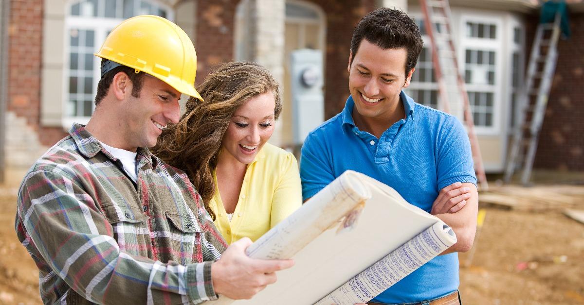 homeowners excitedly looking at a plan