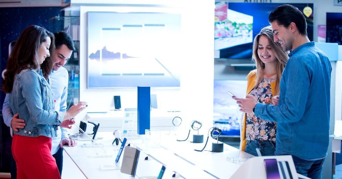 young people shopping for latest phone