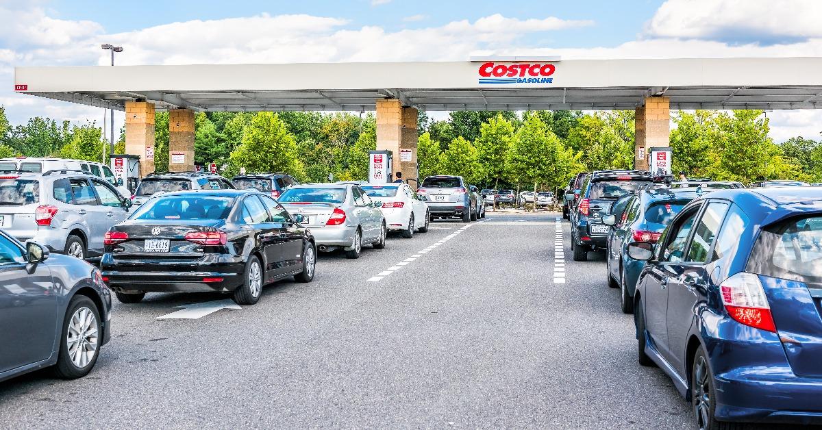 people in cars waiting in long line queue 
