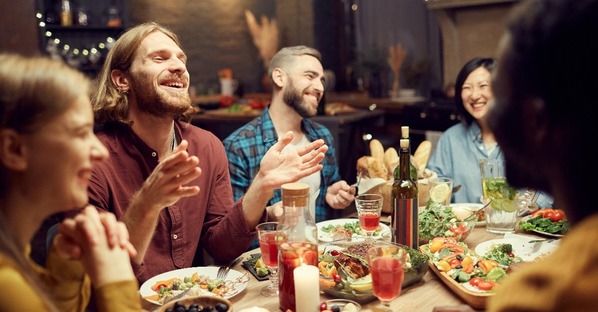 young people enjoying dinner party with friends 