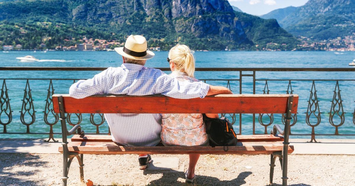 senior couple weekend getaway having rest on the bench