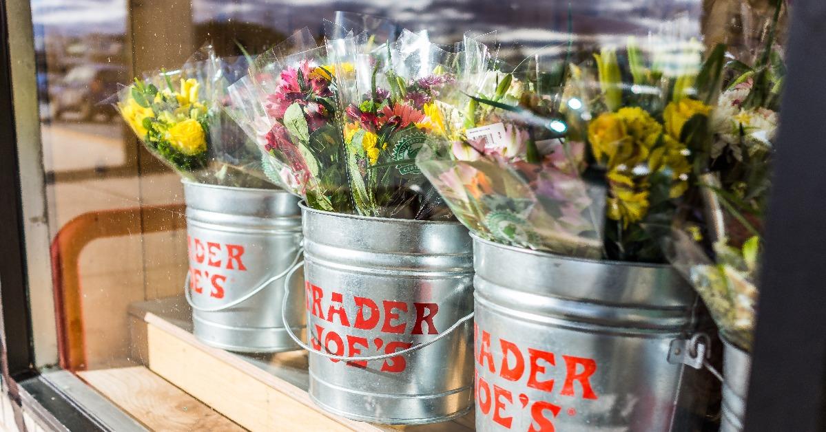 buckets of flowers with Trader Joe's signs 